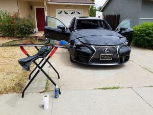 lexus with windshield being replaced