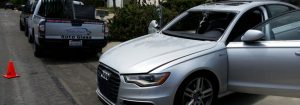 Car getting a side-view mirror replacement in Oceanside, CA.