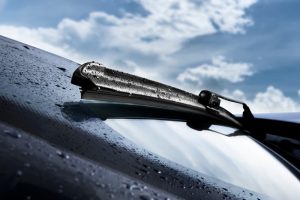 Closeup of wet windshield wiper.